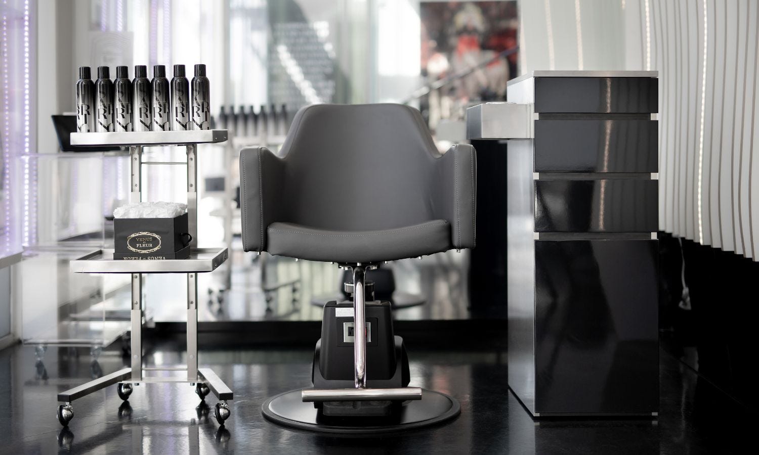 a dark-colored salon chair