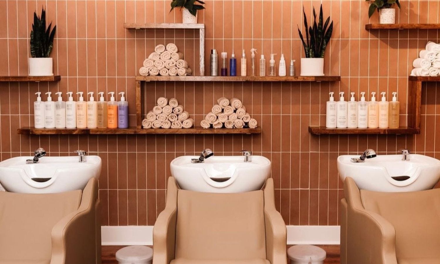 three shampoo bowls in a salon