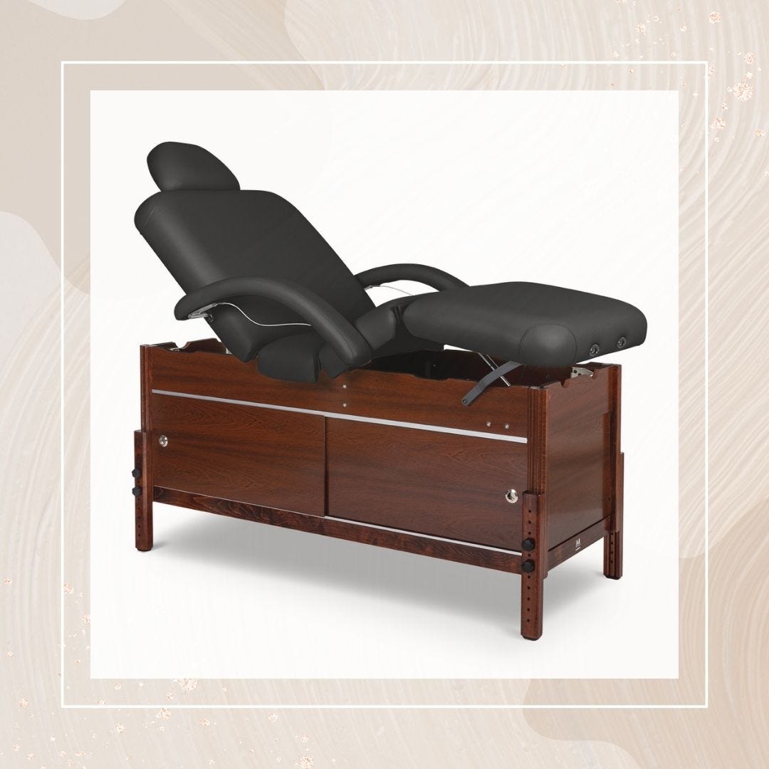 adjustable facial bed with wood frame and black vinyl upholstery