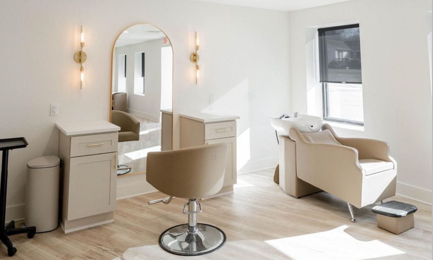 salon suite business in multi-suite building outfitted with styling station, mirror, chair and shampoo system