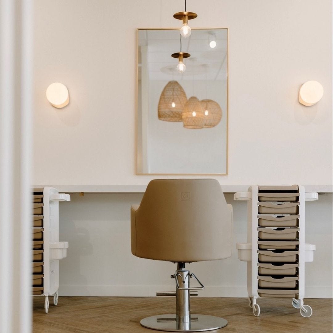 salon station with Italian-made hair color trolley with multiple drawers, bowl holders, accessory baskets, slim wheels and large work surface