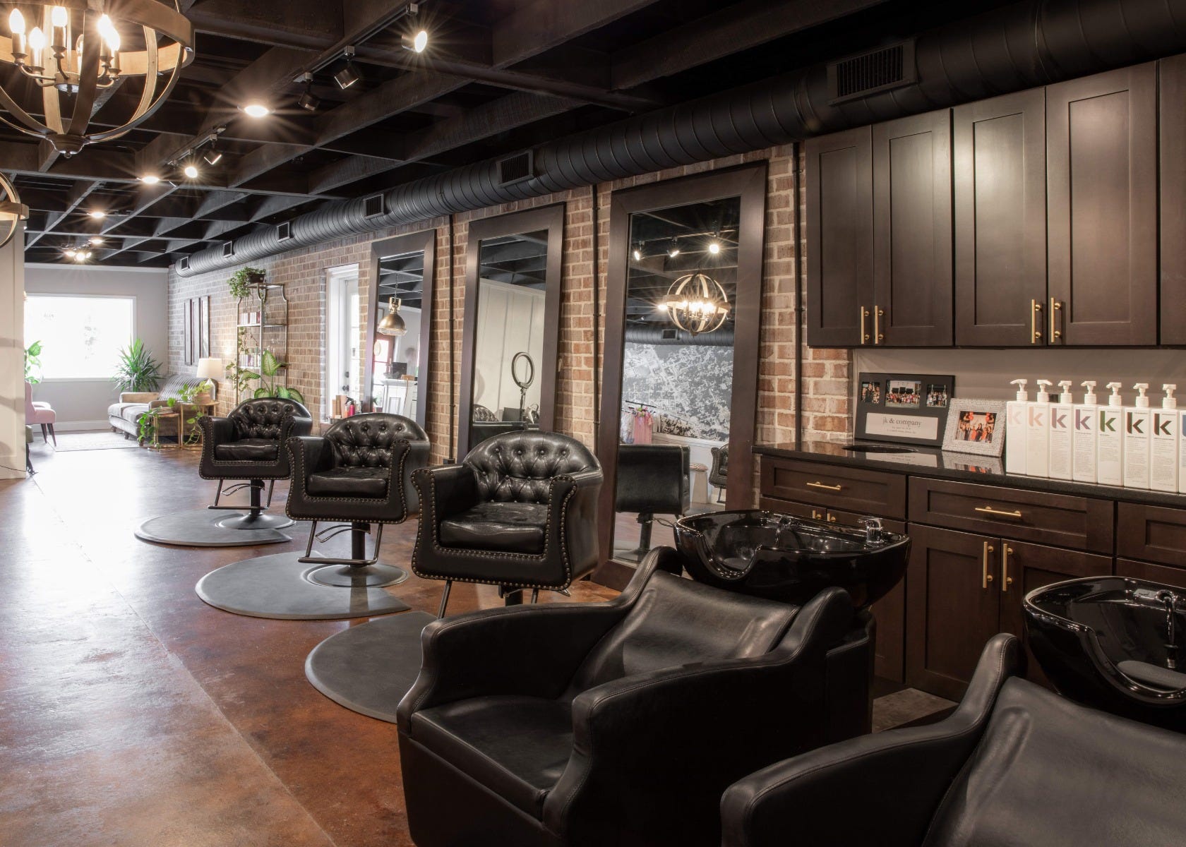 hair salon with color drenching and architectural lighting, both interior design trends in 2025