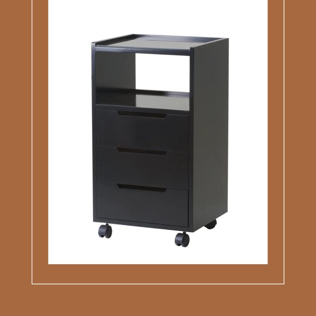 sustainably made black mobile salon cart with three drawers, open shelf and large work surface