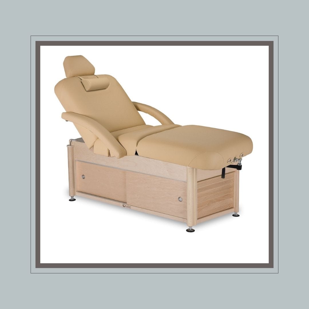 spa streatment bed with built-in storage drawers in base