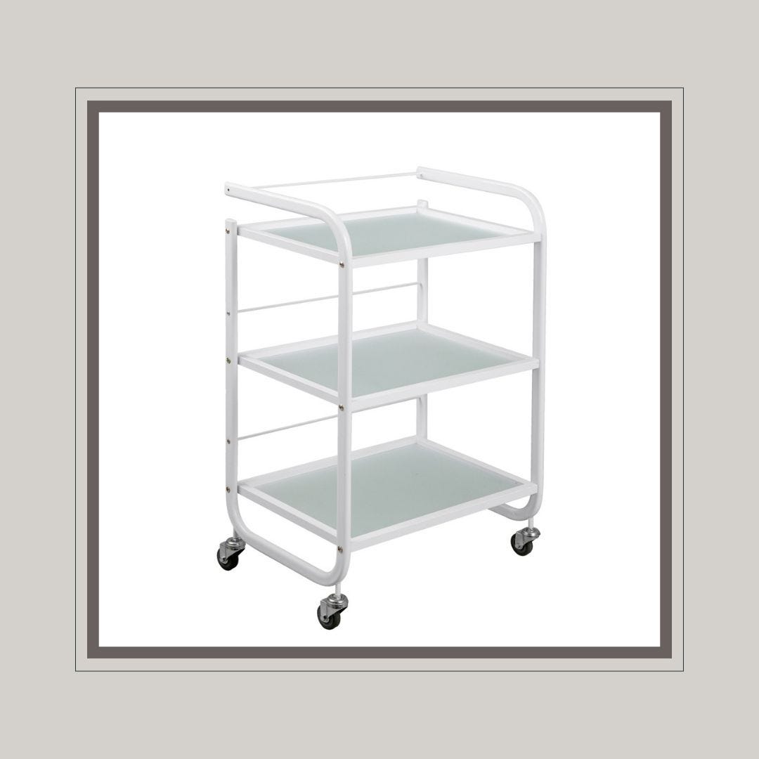 rolling white spa cart with stainless steel frame and three frosted glass shelves