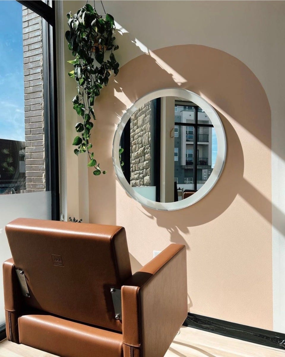 budget-friendly salon styling chair and round mirror