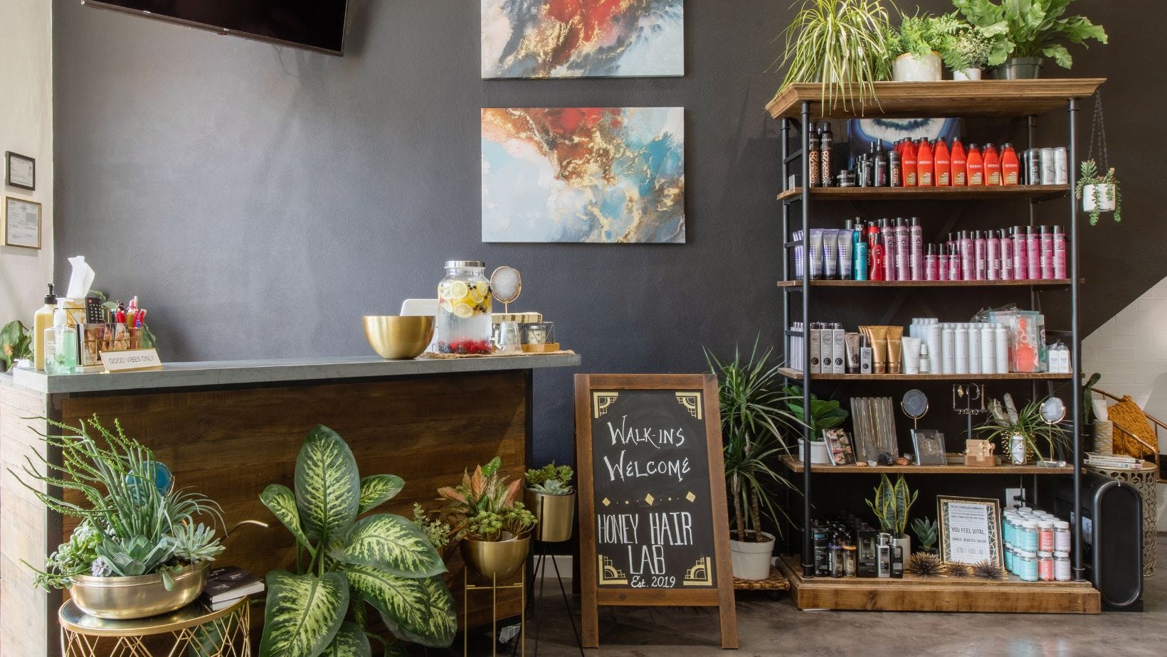 reception area in eco friendly hair salon with sustainable products for sale