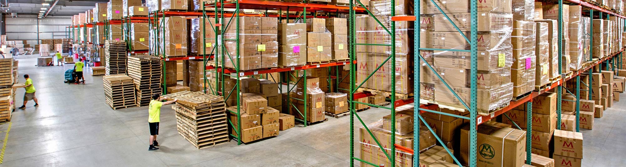 Minerva Beauty salon equipment warehouse with shelves and pallets of products being prepared for shipping
